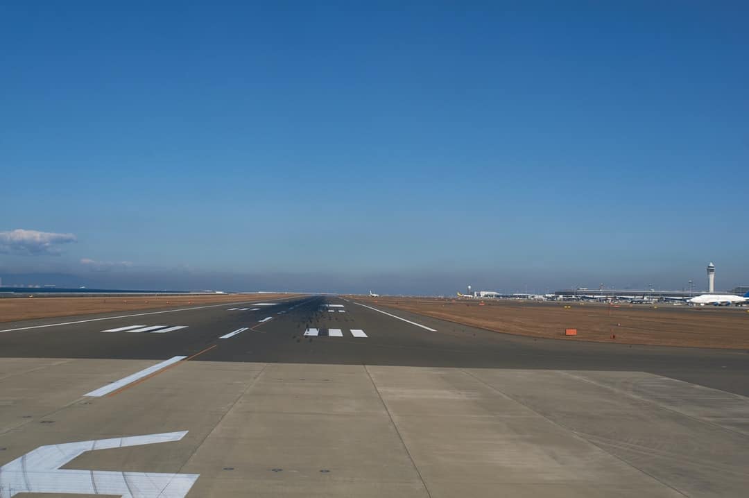 A large air plane on a runway at an airport